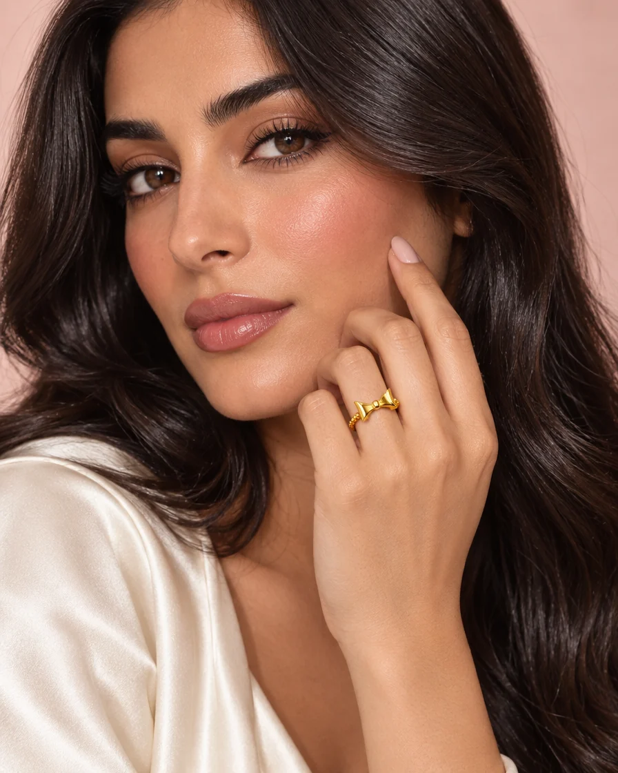 Model wearing the 18K gold bow ring