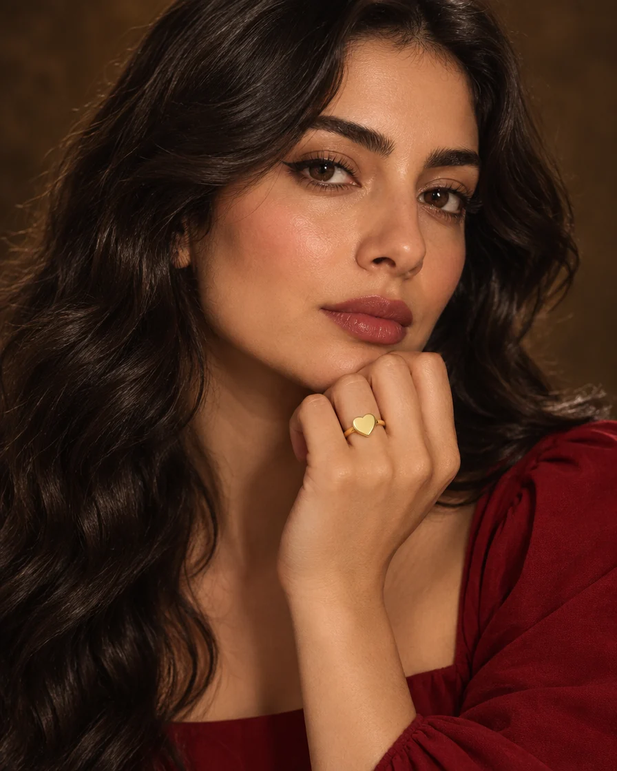 Model wearing the 18K gold heart signet ring