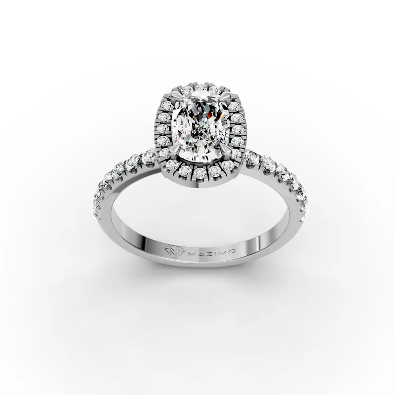 Three-quarter view from above of a white gold ring with a long cushion-cut diamond inside a halo of small diamonds, with straight sides and rounded corners