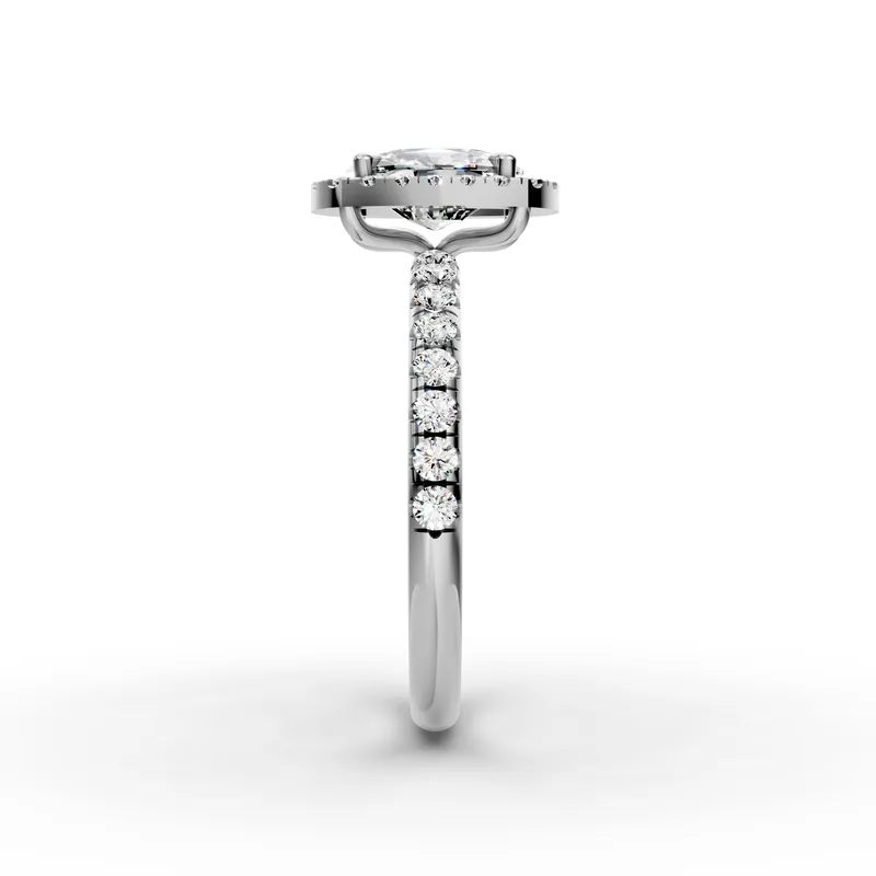 Side view of a white gold ring: the cushion's crown rises through the halo, held by claws at the corners, with small diamonds down the band