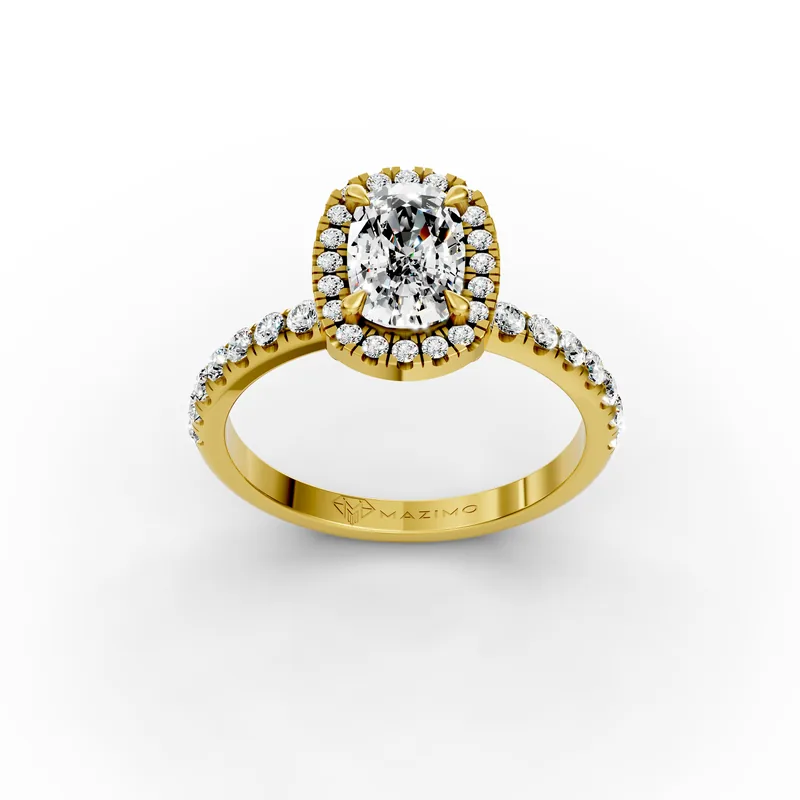 Three-quarter view from above of a yellow gold ring: a long cushion-cut diamond in four claws, a halo of small diamonds around it and more down the band