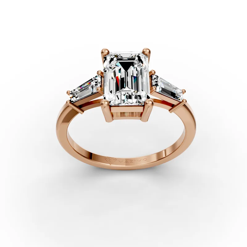 Emerald-cut diamond with a tapered baguette on each side, on a rose gold band, three-quarter view