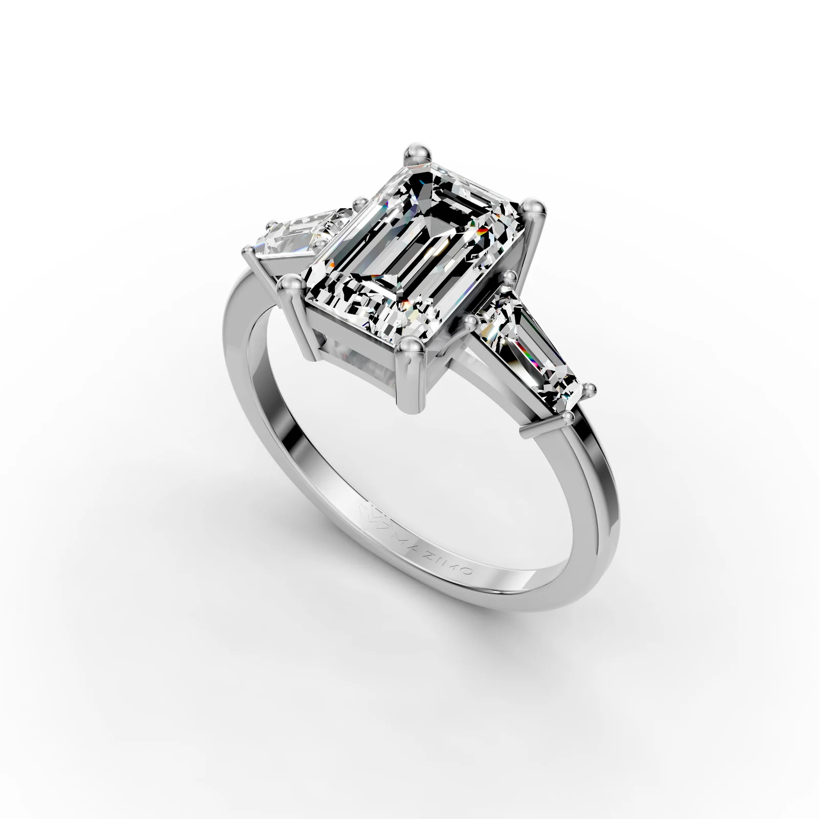 Emerald and Baguette Three Stone Ring in 18K White Gold, 2 ct emerald-cut diamond with two tapered baguettes, angled view