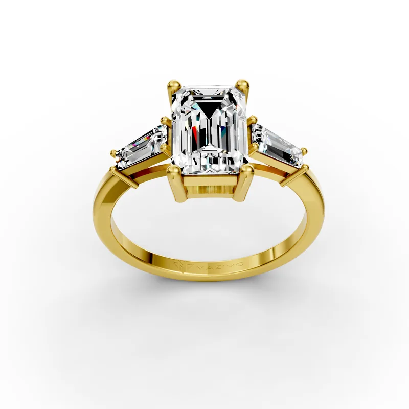 Emerald and Baguette Three Stone Ring in 18K yellow gold