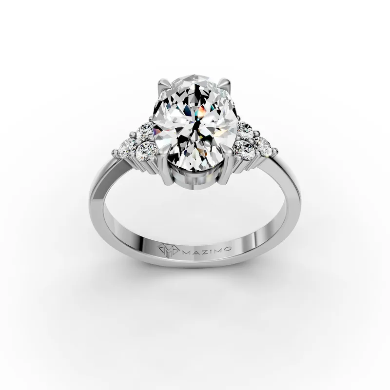 Oval diamond ring in 18K white gold seen from above, with a triangle of three small round diamonds on each side of the centre stone