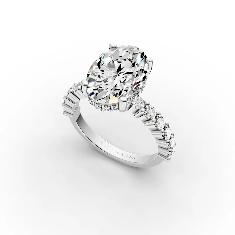 Oval Hidden Halo Shoulders Ring in 18K White Gold, 3.5 ct oval diamond with round diamonds along the band, angled view