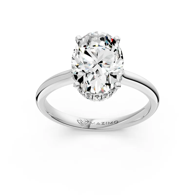 Render of an oval diamond in four claws with a small halo of stones beneath it, in white gold