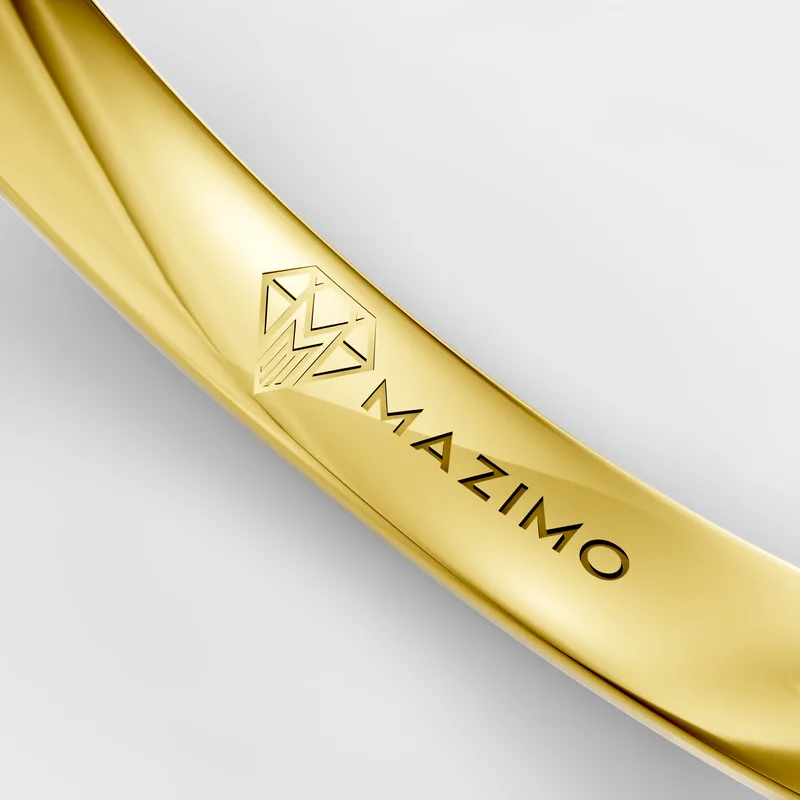 Close-up of the inside of a rendered yellow gold band with the MAZIMO name and diamond logo cut into it