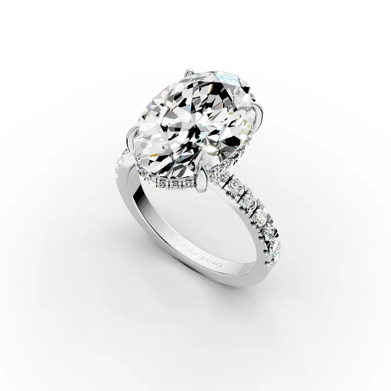 Oval Pavé Hidden Halo Ring, 5.5 ct in 18K White Gold, 5.5 ct oval diamond in four claws with a hidden halo and a pavé band, angled view
