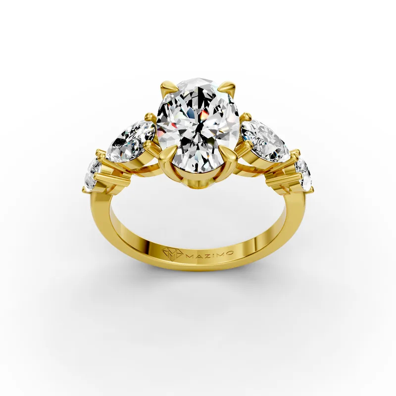 Oval diamond in yellow gold with two pear diamonds stepping down each shoulder, three-quarter view