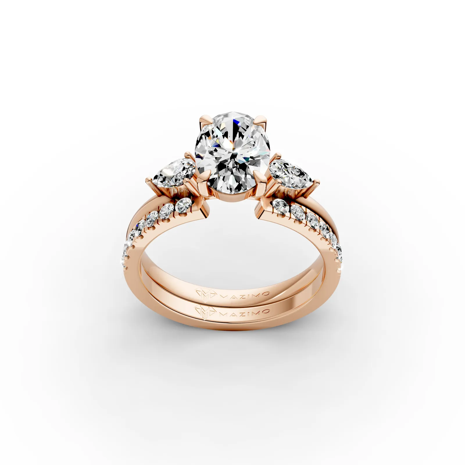 Oval and Pear Three Stone Pavé Ring in 18K Rose Gold, 1.5 ct oval diamond between two pear diamonds on a pavé band, three-quarter view