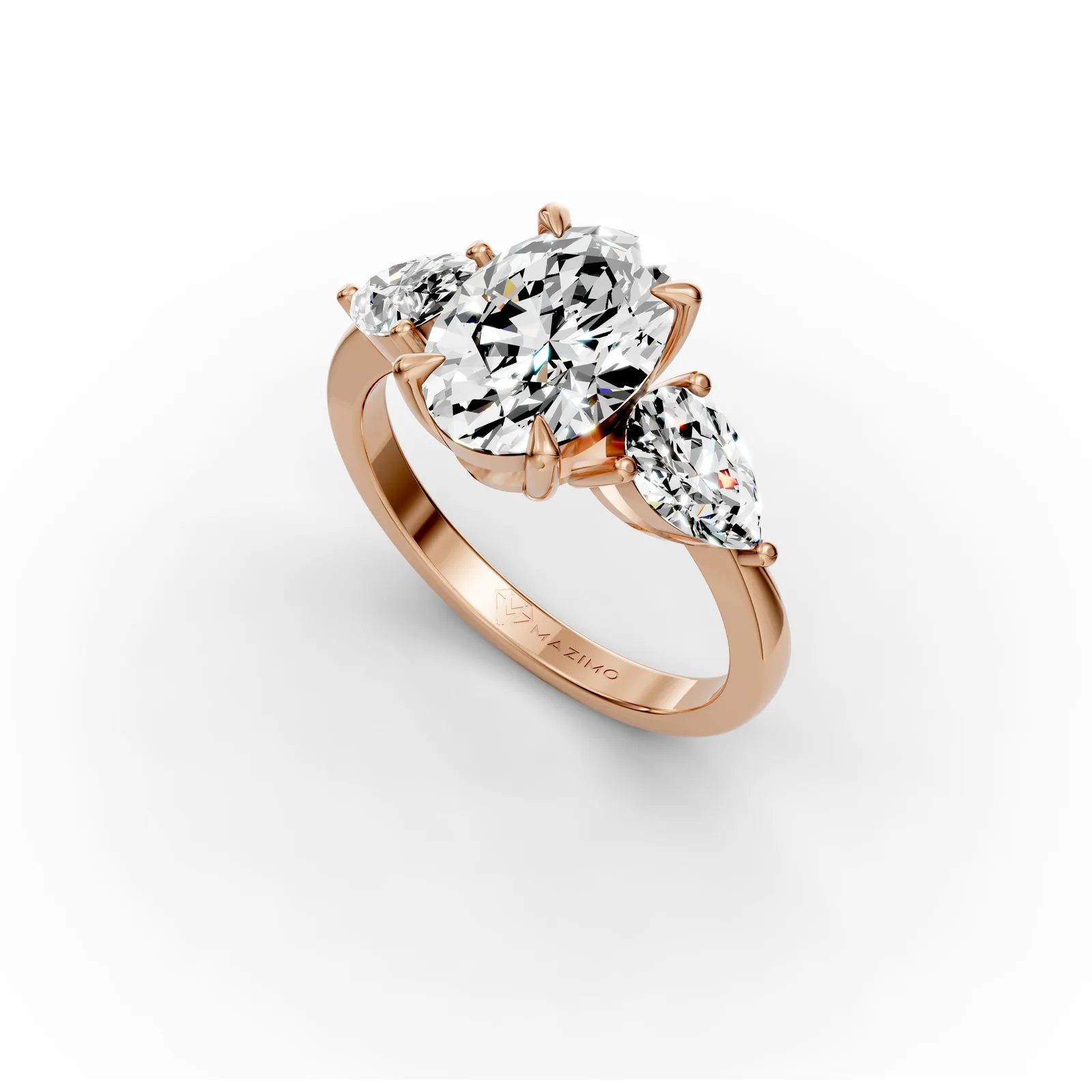 Oval and Pear Three Stone Ring in 18K Rose Gold, angled view