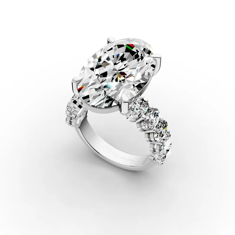 Oval Side Stone Ring, 10 ct in 18K White Gold, 10 ct oval diamond in four claws with oval diamonds along the band, angled view
