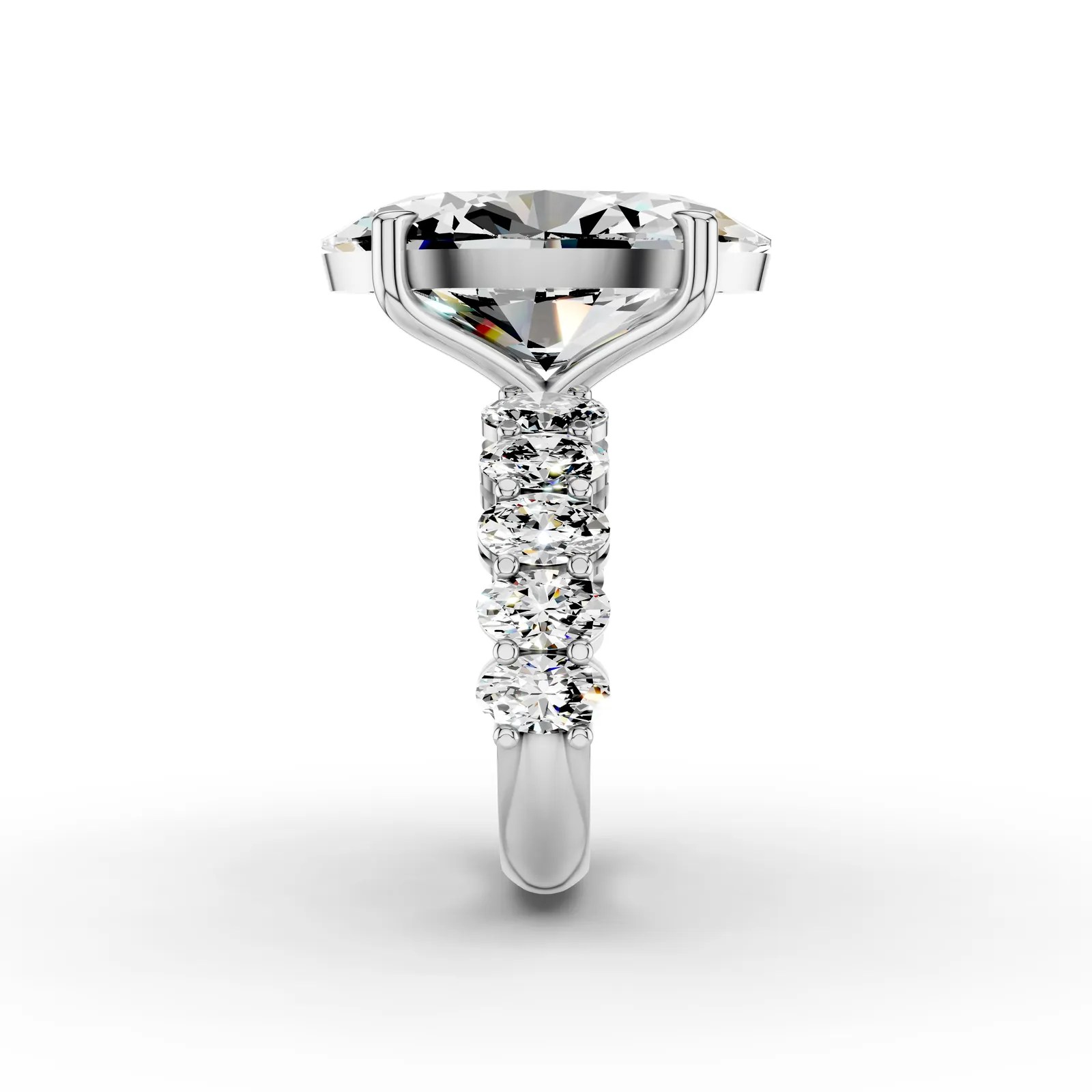 Oval Side Stone Ring, 10 ct in 18K White Gold, 10 ct oval diamond in four claws with oval diamonds along the band, side profile