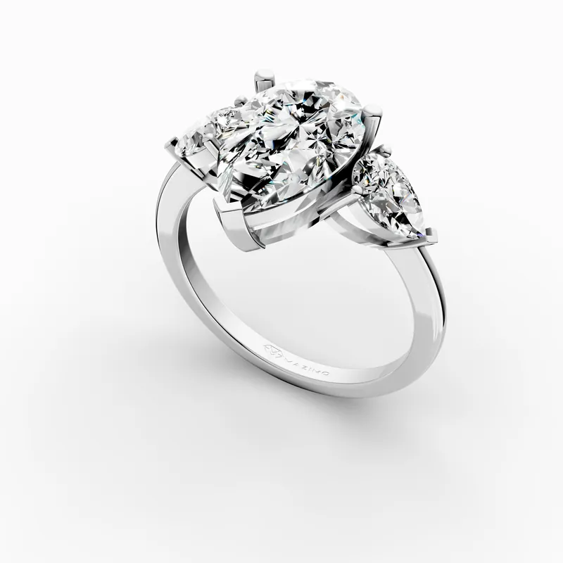 Pear Three Stone Ring in 18K White Gold, 2 ct pear diamond with a pear diamond on each side, angled view
