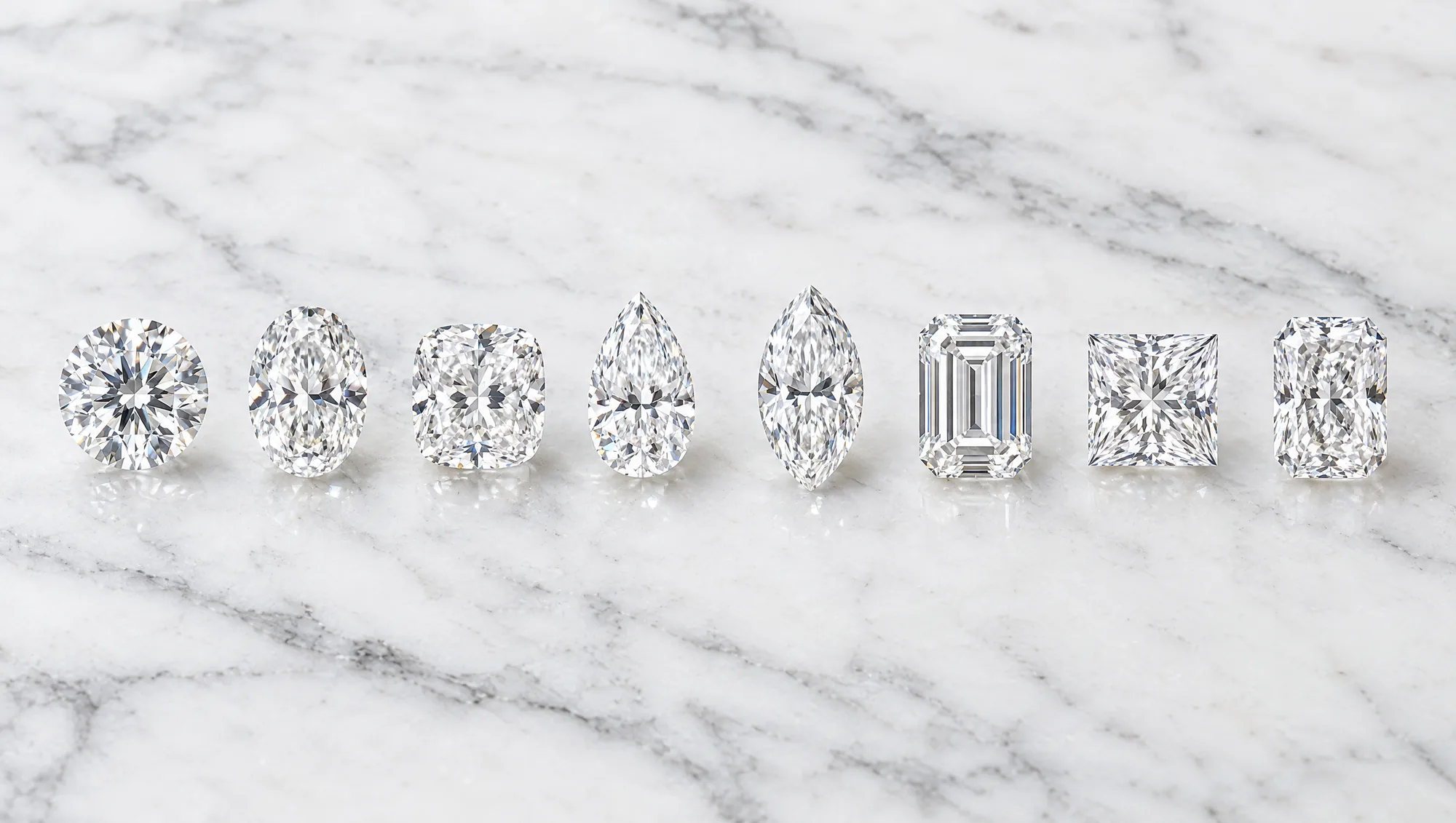 Eight loose diamonds in a row: round, oval, cushion, pear, marquise, emerald, princess and radiant