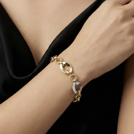 18K gold Mazimo collection oval link bracelet with textured gold rings and white gold accents, 11.40 grams