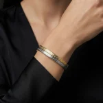 18K gold Mazimo collection two-tone Greek key slim bangle in yellow and white gold, 7.40 grams