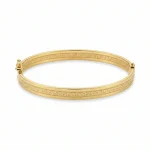 18K gold Mazimo Greek key engraved bangle bracelet with polished finish, 8.10 grams