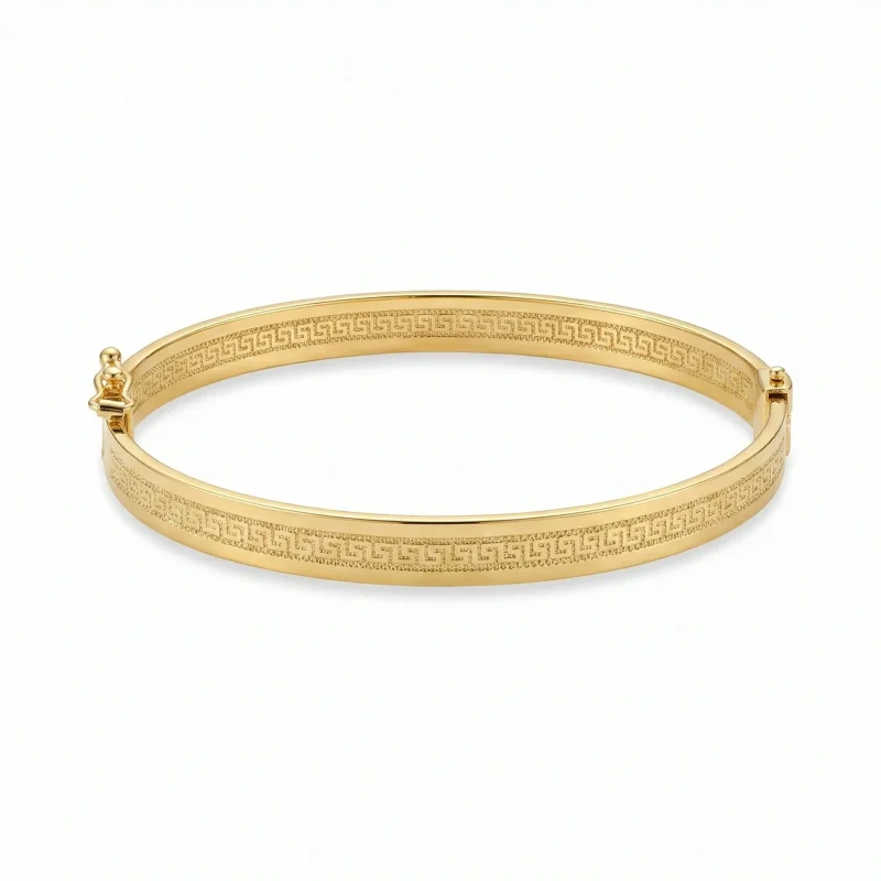 18K gold Mazimo Greek key engraved bangle bracelet with polished finish, 8.10 grams